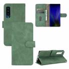 For Fujitsu Arrows NX9 F-52A Solid Color Skin Feel Magnetic Buckle Horizontal Flip Calf Texture PU Leather Case with Holder & Card Slots & Wallet(Green) - 1