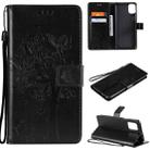 For LG K42 Tree & Cat Pattern Pressed Printing Horizontal Flip PU Leather Case with Holder & Card Slots & Wallet & Lanyard(Black) - 1