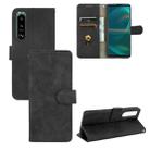 For Sony Xperia 5 III Solid Color Skin Feel Magnetic Buckle Horizontal Flip Calf Texture PU Leather Case with Holder & Card Slots & Wallet(Black)) - 1