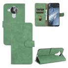 For Nokia 7.3 Solid Color Skin Feel Magnetic Buckle Horizontal Flip Calf Texture PU Leather Case with Holder & Card Slots & Wallet(Green) - 1