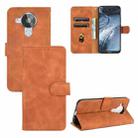 For Nokia 7.3 Solid Color Skin Feel Magnetic Buckle Horizontal Flip Calf Texture PU Leather Case with Holder & Card Slots & Wallet(Brown) - 1