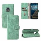 Solid Color Skin Feel Magnetic Buckle Horizontal Flip Calf Texture PU Leather Case with Holder & Card Slots & Wallet For Nokia XR20(Green) - 1