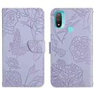 For Motorola Moto E20 / E30 / E40 Skin Feel Butterfly Peony Embossed Leather Phone Case(Purple) - 1