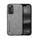 For Xiaomi 12 Skin Feel Magnetic Leather Back Phone Case(Light Grey) - 1