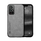 For Xiaomi Redmi Note 11 5G Skin Feel Magnetic Leather Back Phone Case(Light Grey) - 1
