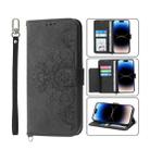 For iPhone 14 Pro Skin-feel Flowers Embossed Wallet Leather Phone Case(Black) - 1