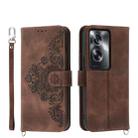 For OPPO A2 Skin-feel Flowers Embossed Wallet Leather Phone Case(Brown) - 1