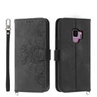 For Samsung Galaxy S9 Skin-feel Flowers Embossed Wallet Leather Phone Case(Black) - 1