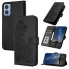 For Motorola Moto E22 Datura Flower Embossed Flip Leather Phone Case(Black) - 1