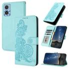 For Motorola Moto E22 Datura Flower Embossed Flip Leather Phone Case(Light blue) - 1