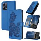 For Xiaomi Redmi Note 12 5G Global Datura Flower Embossed Flip Leather Phone Case(Blue) - 1