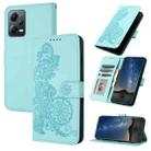 For Xiaomi Redmi Note 12 5G Global Datura Flower Embossed Flip Leather Phone Case(Light blue) - 1