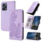 For Xiaomi Redmi Note 12 5G Global Datura Flower Embossed Flip Leather Phone Case(Purple) - 1