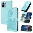 For Xiaomi Mi 11 Datura Flower Embossed Flip Leather Phone Case(Light blue) - 1