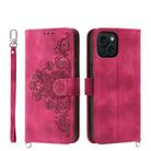 For iPhone 15 Skin-feel Flowers Embossed Wallet Leather Phone Case(Wine Red) - 1