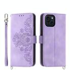 For iPhone 15 Skin-feel Flowers Embossed Wallet Leather Phone Case(Purple) - 1