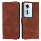 For OPPO Reno11 F Skin Feel Heart Embossed Leather Phone Case with Long Lanyard(Brown) - 1