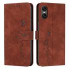 For Sony Xperia 10 VI Skin Feel Heart Embossed Leather Phone Case with Long Lanyard(Brown) - 1