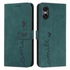 For Sony Xperia 5 VI Skin Feel Heart Embossed Leather Phone Case with Long Lanyard(Green) - 1