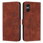 For Sony Xperia 5 VI Skin Feel Heart Embossed Leather Phone Case with Long Lanyard(Brown) - 1