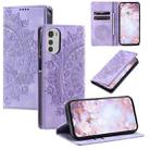 For Motorola Moto E32 Totem Embossed Magnetic Leather Phone Case(Purple) - 1