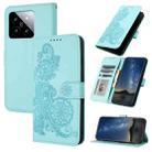 For Xiaomi 14 Datura Flower Embossed Flip Leather Phone Case(Light blue) - 1