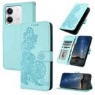 For Xiaomi Redmi Note 13 4G Datura Flower Embossed Flip Leather Phone Case(Light blue) - 1