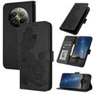 For Realme 12+ 5G Global Datura Flower Embossed Flip Leather Phone Case(Black) - 1