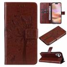 For iPhone 16 Plus Tree & Cat Embossed Pattern Flip Leather Phone Case(Coffee) - 1