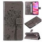 For iPhone 16 Tree & Cat Embossed Pattern Flip Leather Phone Case(Grey) - 1