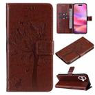 For iPhone 16 Tree & Cat Embossed Pattern Flip Leather Phone Case(Coffee) - 1