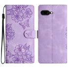 For Google Pixel 9a Cherry Blossom Butterfly Skin Feel Embossed PU Phone Case(Purple) - 1