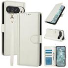 For Google Pixel 9 / 9 Pro Skin Feel Pure Color Card Slots Leather Phone Case with Dual Lanyard(White) - 1