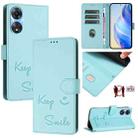 For OPPO A78 5G Global / A1X 5G Smile Embossing RFID Leather Phone Case(Mint Green) - 1