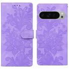 For Google Pixel 9 / 9 Pro Lace Floral Embossed Magnetic Buckle PU Phone Case With Wrist Strap(Purple) - 1