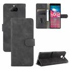 For Sony Xperia 8 Solid Color Skin Feel Magnetic Buckle Horizontal Flip Calf Texture PU Leather Case with Holder & Card Slots & Wallet(Black) - 1