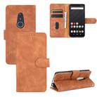 For Fujitsu Arrows Be4 (F-41A) Solid Color Skin Feel Magnetic Buckle Horizontal Flip Calf Texture PU Leather Case with Holder & Card Slots & Wallet(Brown) - 1