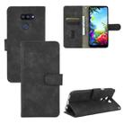 For LG K40S Solid Color Skin Feel Magnetic Buckle Horizontal Flip Calf Texture PU Leather Case with Holder & Card Slots & Wallet(Black) - 1