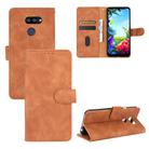 For LG K40S Solid Color Skin Feel Magnetic Buckle Horizontal Flip Calf Texture PU Leather Case with Holder & Card Slots & Wallet(Brown) - 1