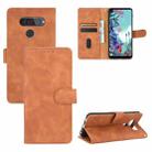 For LG Q70 Solid Color Skin Feel Magnetic Buckle Horizontal Flip Calf Texture PU Leather Case with Holder & Card Slots & Wallet(Brown) - 1