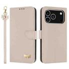 For iPhone 17 Pro Metal Bow Leather Phone Case with Hand Strap(Apricot) - 1