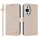 For Huawei nova 12s 4G Global Metal Bow Leather Phone Case with Hand Strap(Apricot) - 1