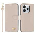 For Redmi Note 14 5G Metal Bow Leather Phone Case with Hand Strap(Apricot) - 1