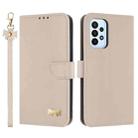 For Samsung Galaxy A23 4G / 5G Metal Bow Leather Phone Case with Hand Strap(Apricot) - 1