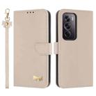 For OPPO Reno12 Pro 5G Metal Bow Leather Phone Case with Hand Strap(Apricot) - 1