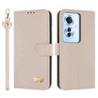 For OPPO Reno11 F / F21 Pro India Metal Bow Leather Phone Case with Hand Strap(Apricot) - 1