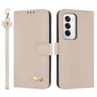 For OPPO Reno12 5G Global Metal Bow Leather Phone Case with Hand Strap(Apricot) - 1