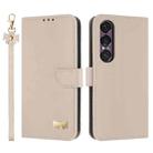 For Sony Xperia 1 VII Metal Bow Leather Phone Case with Hand Strap(Apricot) - 1