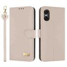 For Sony Xperia 10 VI Metal Bow Leather Phone Case with Hand Strap(Apricot) - 1