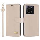 For Xiaomi 13T / 13T Pro Metal Bow Leather Phone Case with Hand Strap(Apricot) - 1